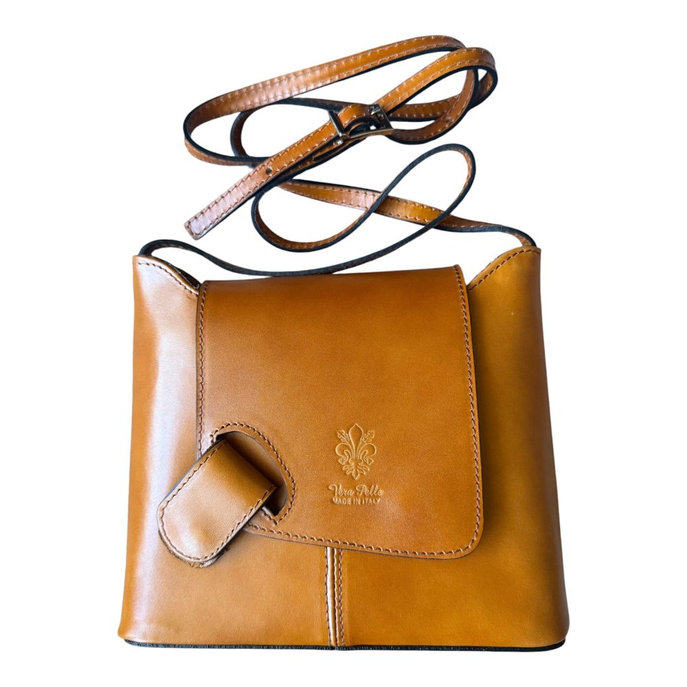 LaGaksta cognac tan Italian leather crossbody with embossed ‘Vera Pelle Made in Italy’ text on the front flap, adjustable shoulder strap, and sleek minimalist design