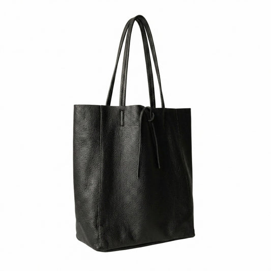 LaGaksta Taylor black Italian leather tote bag with leather tie closure, side angle view