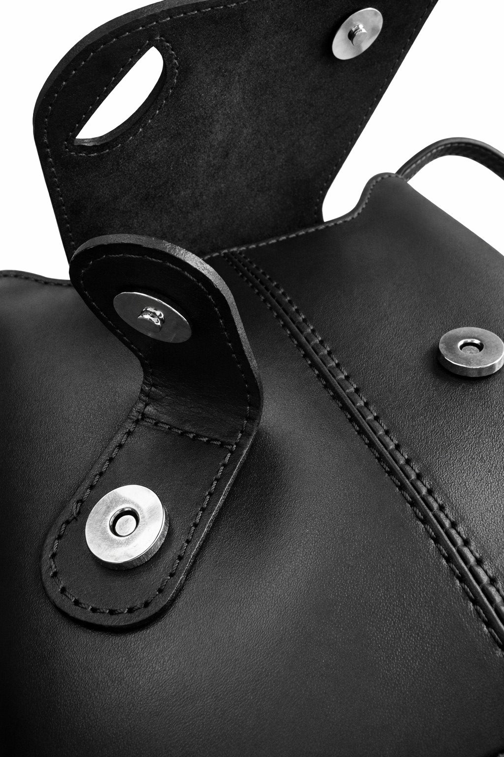 LaGaksta Black Italian leather crossbody showing the magnetic turn lock and magnetic snap
